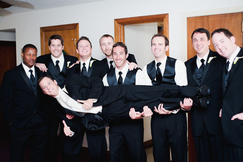 4_groomsmen_holding_groom_photo weddings austin 4 groomsmen holding groom photo Austin Wedding Photography | Saint Austins Cathedral and Texas Federation of Womens Club Mansion Wedding