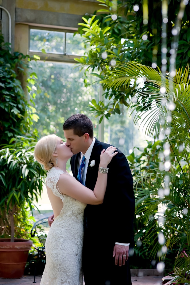 bride groom kissing under waterfall