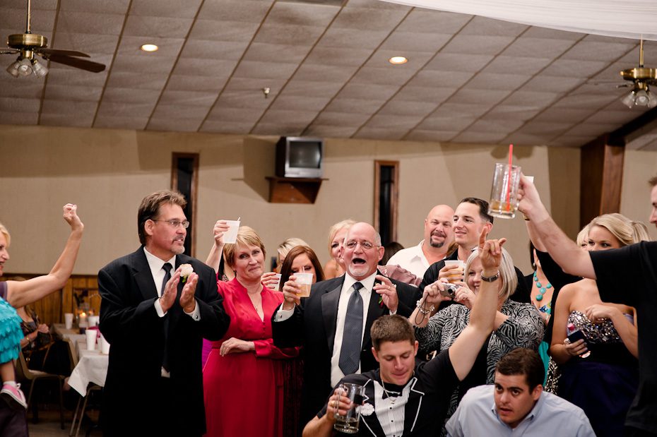 family_cheering_during_toasts_wedding_reception weddings ennis austin Germenis 1261 Austin Wedding Photographer | Central Texas Autumn Wedding