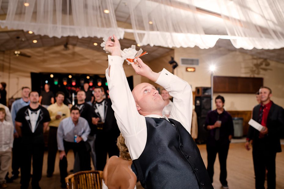 groom_tossing_garter weddings ennis austin Germenis 1381 Austin Wedding Photographer | Central Texas Autumn Wedding