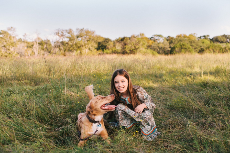 family portrait session photo of girl with dogs